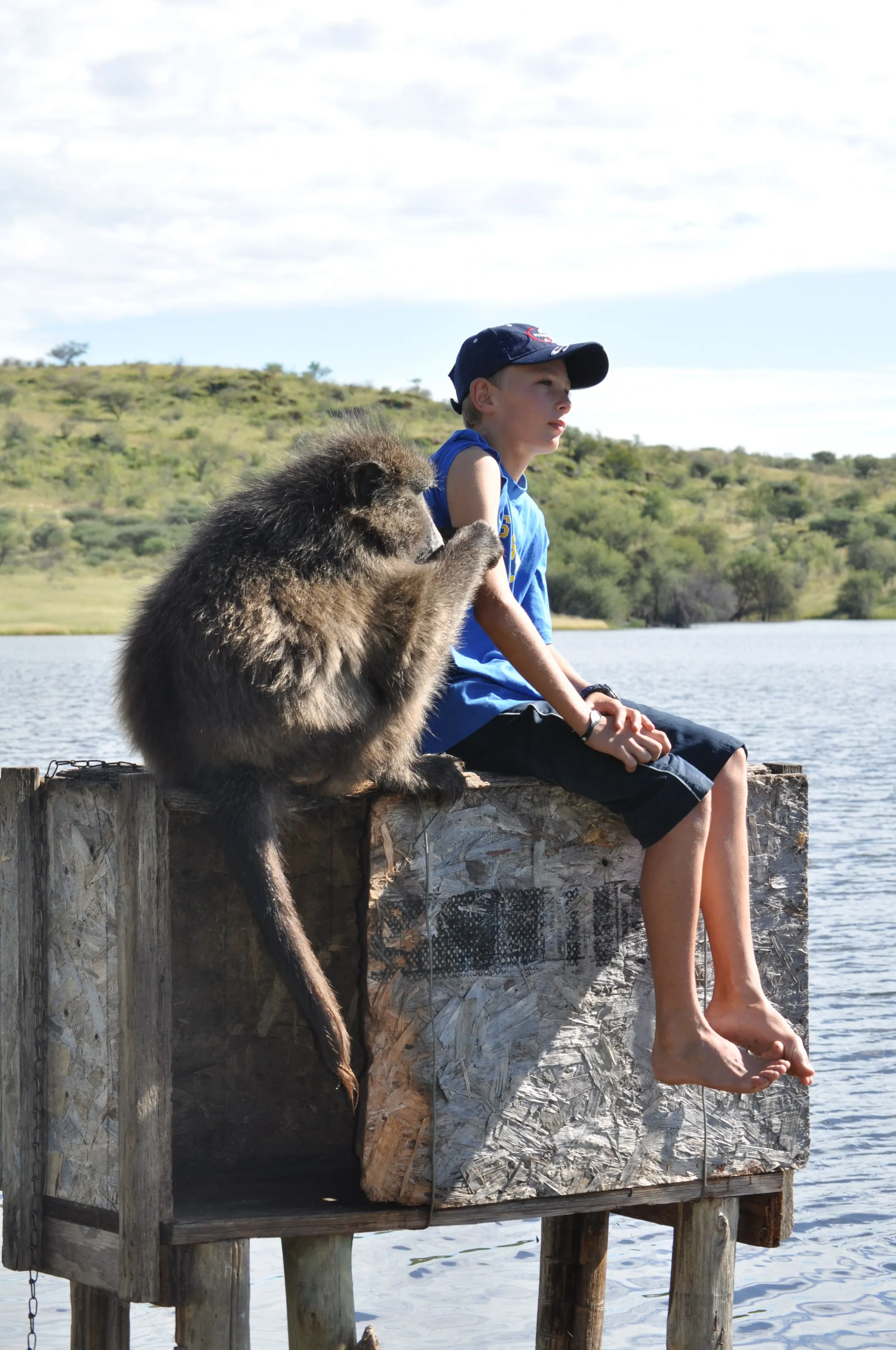 Archive photo: a boy sitting beside Cindy at the dam